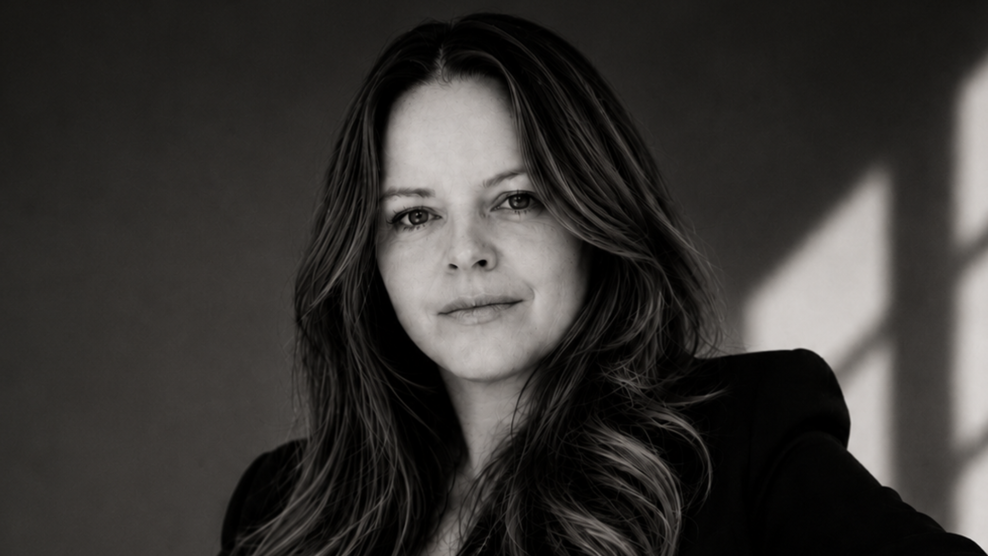 Black and white editorial portrait, still and unguarded